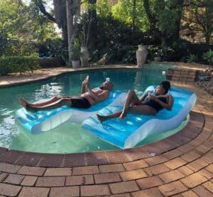 Relaxing couple on the pool at L'abri